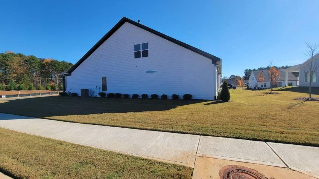 Exterior details and patio area of a home in The Reserve at Bells Ferry, Kennesaw (Image 29).