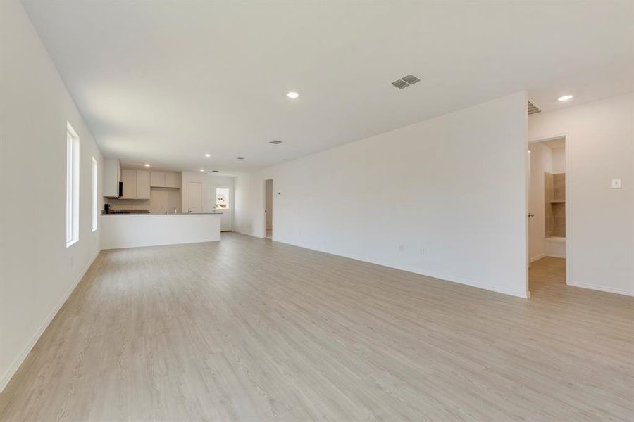 Unfurnished living room featuring light wood-type flooring