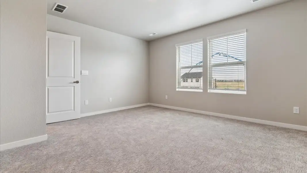 Spacious, unfurnished interior of a new home in Sky Ranch, Watkins (Image 16).