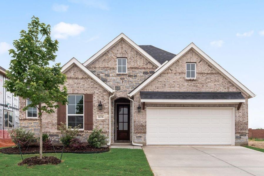 Front exterior of a new home in Wildflower Ranch, Fort Worth, TX, highlighting curb appeal (Image 20).