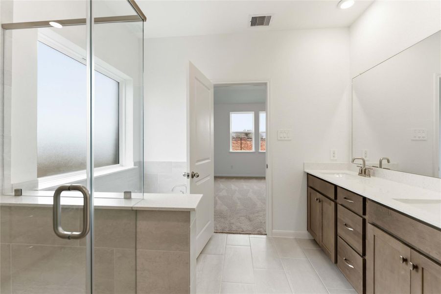 Furnished interior view inside a new home in Sunterra, Katy (Image 8).