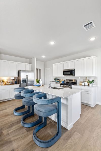 Kitchen in a Nicholson Ranch Magnolia Model Home in Lavon TX by Trophy Signature Homes