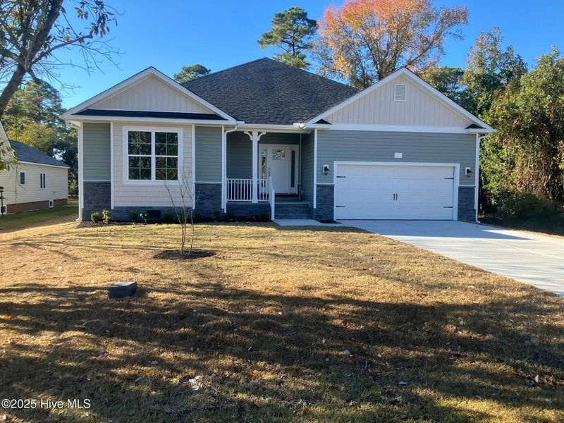 Front exterior of a new home in Fairfield Harbour, New Bern, NC, highlighting curb appeal (Image 1).