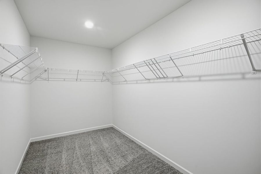 A white room with a staircase.