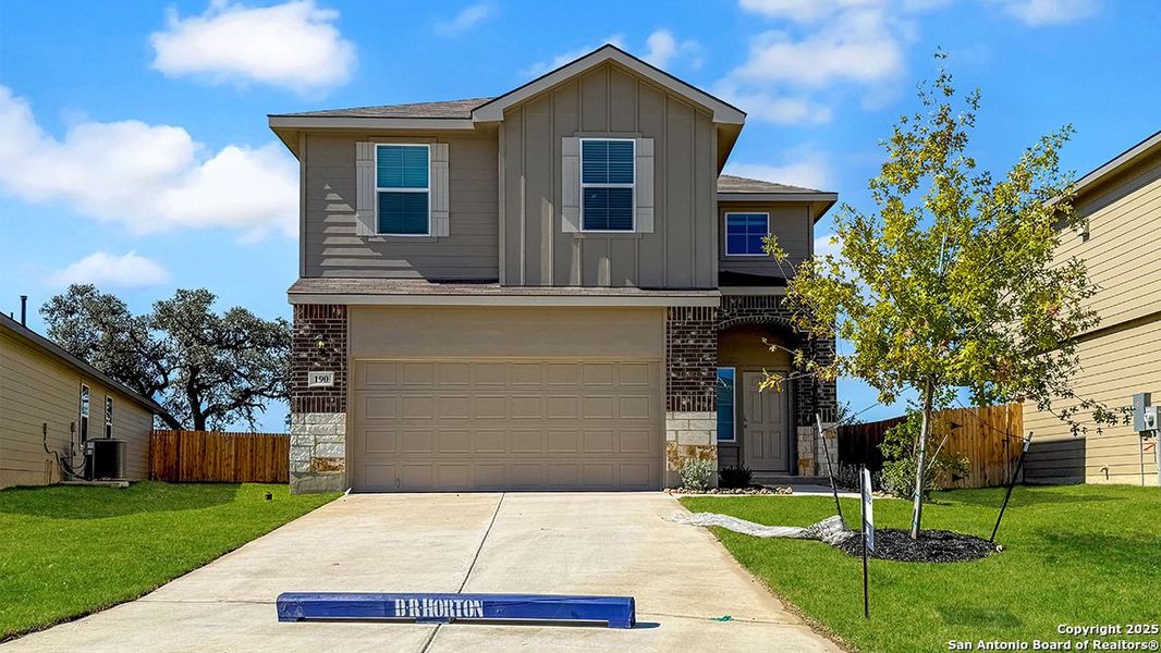 Front exterior of a new home in Redbird Ranch, San Antonio, TX, highlighting curb appeal (Image 2). Front exterior of a new home in Redbird Ranch, San Antonio, TX, highlighting curb appeal (Image 2).