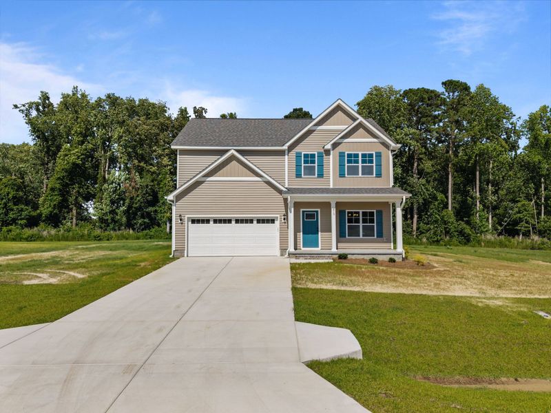 Front exterior of a new home in Laurel Oaks, Greenville, NC, highlighting curb appeal (Image 21). Front exterior of a new home in Laurel Oaks, Greenville, NC, highlighting curb appeal (Image 21).