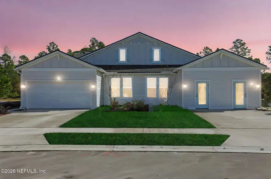 Front exterior of a new home in Seminole Trace, Palm Coast, FL, highlighting curb appeal (Image 1). Front exterior of a new home in Seminole Trace, Palm Coast, FL, highlighting curb appeal (Image 1).