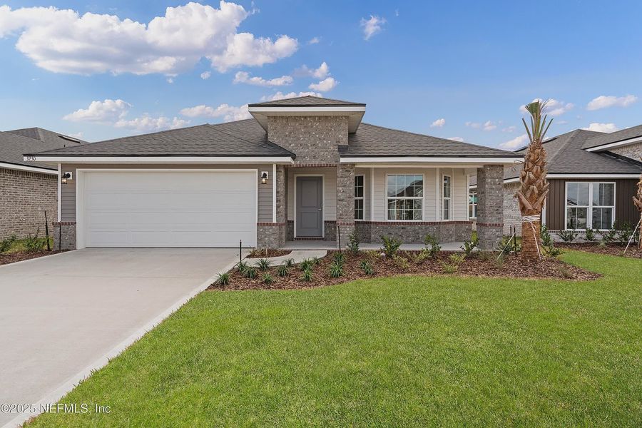 Front exterior of a new home in Shadow Crest at Rolling Hills, Green Cove Springs, FL, highlighting curb appeal (Image 1). Front exterior of a new home in Shadow Crest at Rolling Hills, Green Cove Springs, FL, highlighting curb appeal (Image 1).