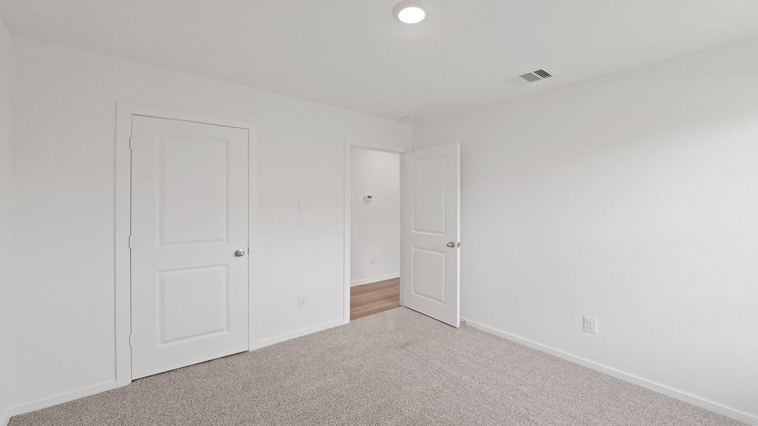 Representative unfurnished interior of a home built from the Estero by D.R. Horton in Lake Conroe Cove, Willis (Image 20). Representative unfurnished interior of a home built from the Estero by D.R. Horton in Lake Conroe Cove, Willis (Image 20).