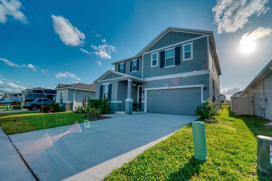 Front exterior of a new home in , Davenport, FL, highlighting curb appeal (Image 30). Front exterior of a new home in , Davenport, FL, highlighting curb appeal (Image 30).