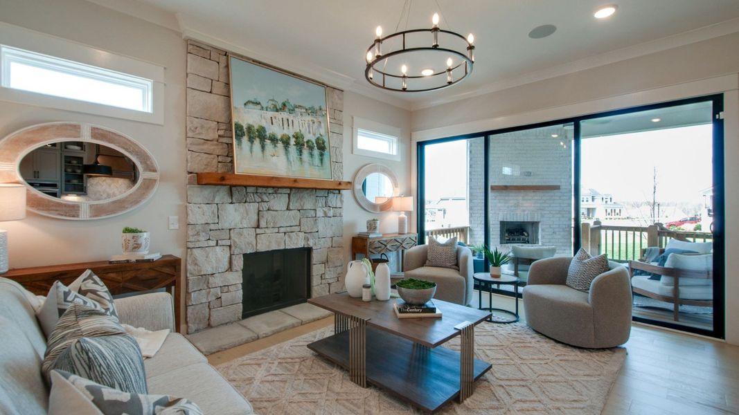 Gathering room with connecting dining area and large glass sliding doors out to the covered outdoor patio space Gathering room with connecting dining area and large glass sliding doors out to the covered outdoor patio space