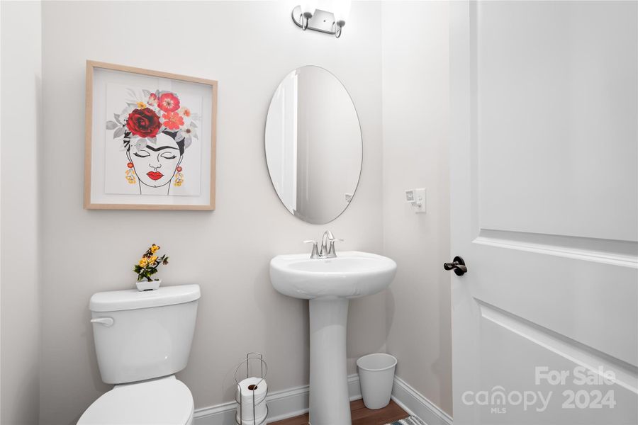 Powder Room is conveniently located off Foyer for easy access by your guests.