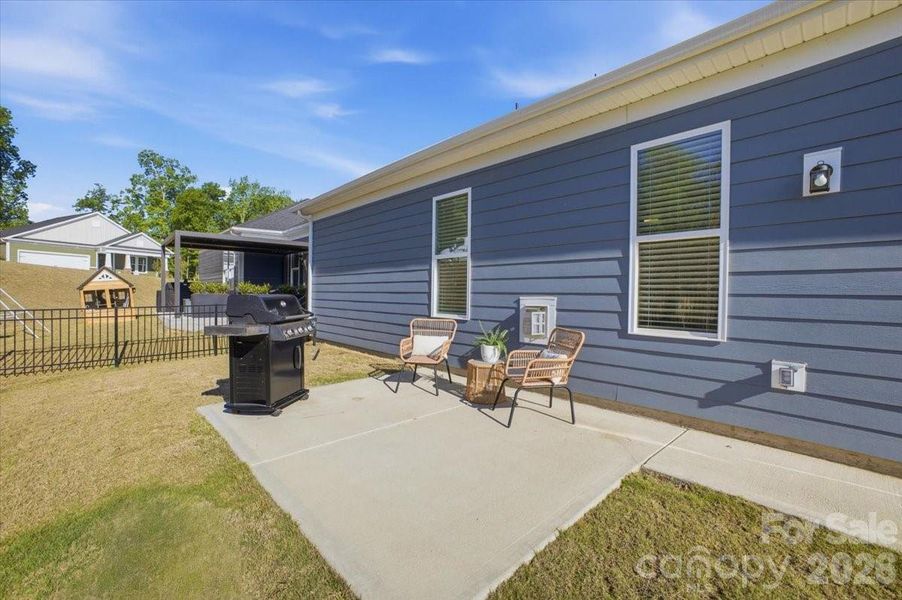 Exterior details and patio area of a home in The Terraces at Cramerton Mills, Cramerton (Image 4).