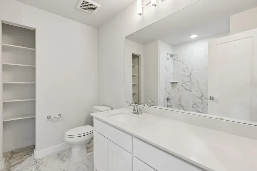 Bathroom in the Stanley II home plan by Trophy Signature Homes – REPRESENTATIVE PHOTO