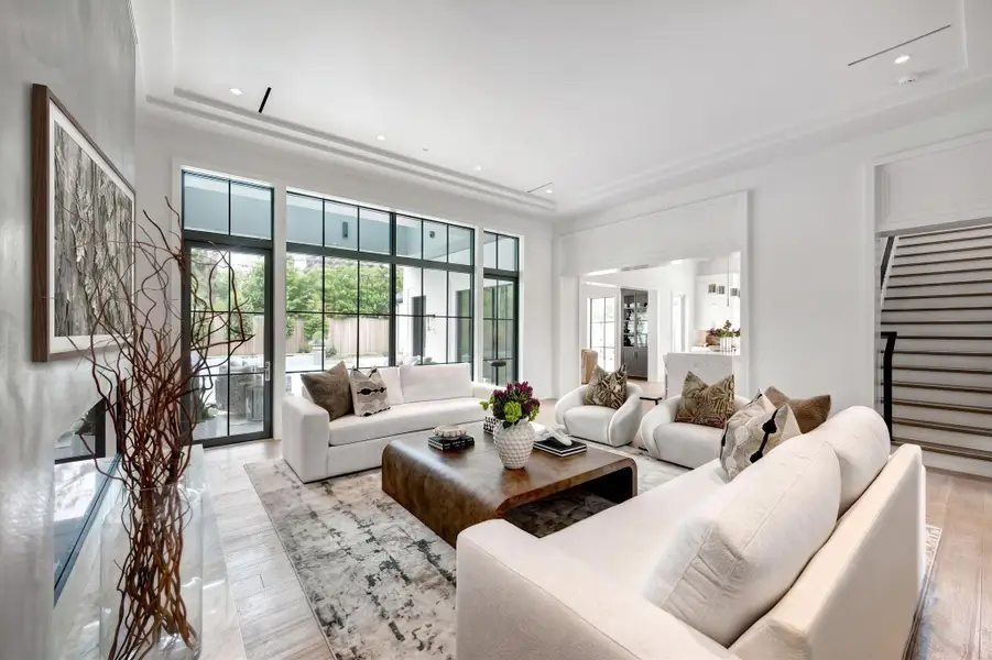 Living room views the covered outdoor patio and pool.  What a view!