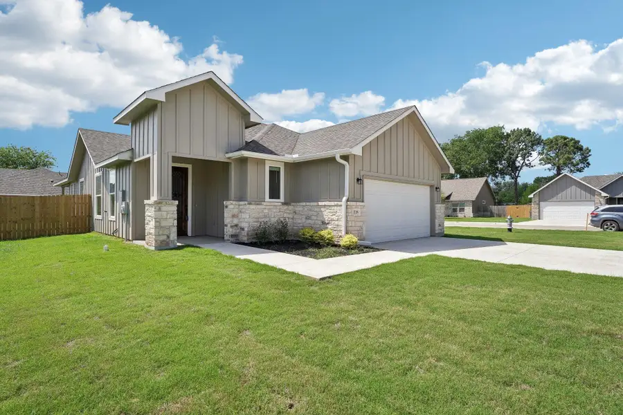 Craftsman house with fence, concrete driveway, an attached garage, roof with shingles, and a front yard Craftsman house with fence, concrete driveway, an attached garage, roof with shingles, and a front yard