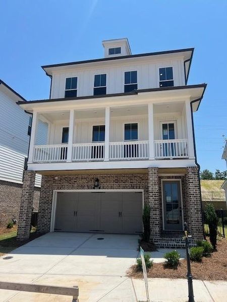 Front exterior of a new home in Palisades Single Family, Cumming, GA, highlighting curb appeal (Image 26).