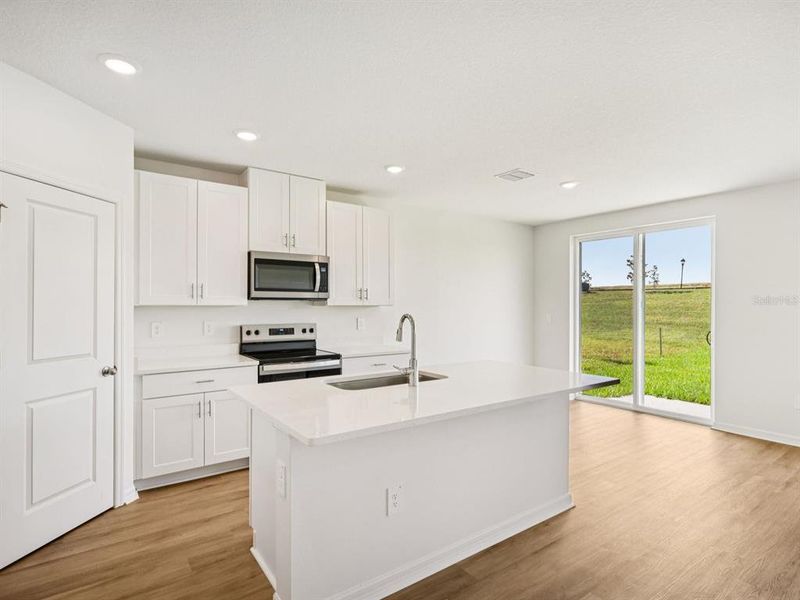 Furnished interior view inside a new home in The Reserve at Van Oaks, Auburndale (Image 4).