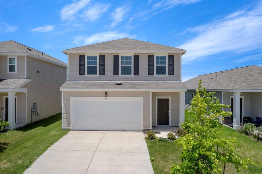 Front exterior of a new home in Cottonwood Farms, Hutto, TX, highlighting curb appeal (Image 1). Front exterior of a new home in Cottonwood Farms, Hutto, TX, highlighting curb appeal (Image 1).
