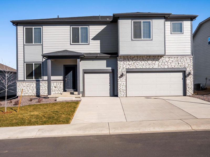 Front exterior of a new home in Poudre Heights: The Alpine Collection, Windsor, CO, highlighting curb appeal (Image 1). Front exterior of a new home in Poudre Heights: The Alpine Collection, Windsor, CO, highlighting curb appeal (Image 1).