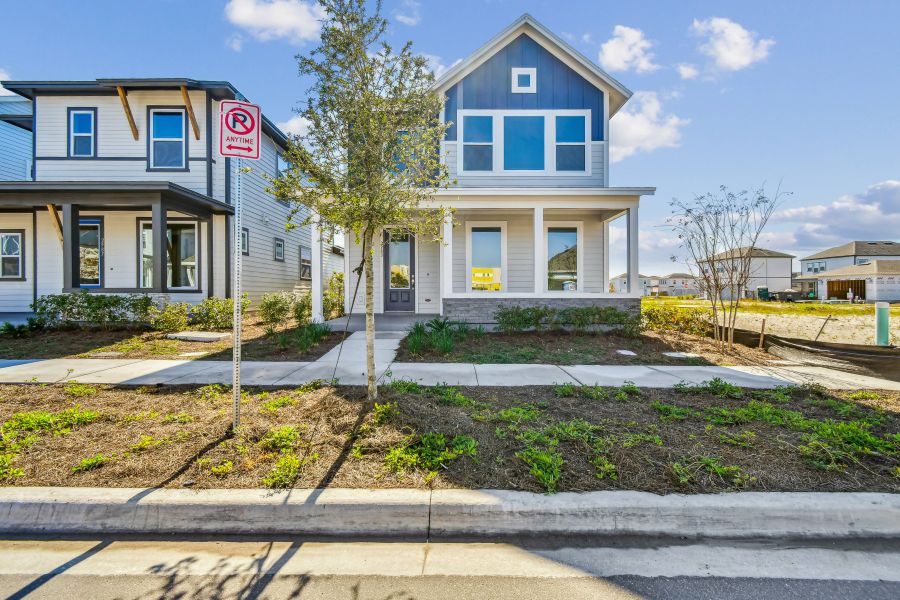 Front exterior of a new home in Weslyn Park in Sunbridge 34', St. Cloud, FL, highlighting curb appeal (Image 2). Front exterior of a new home in Weslyn Park in Sunbridge 34', St. Cloud, FL, highlighting curb appeal (Image 2).