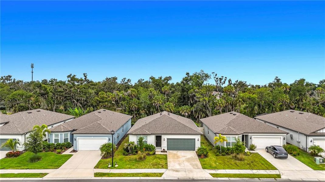 Front exterior of a new home in , Ellenton, FL, highlighting curb appeal (Image 1). Front exterior of a new home in , Ellenton, FL, highlighting curb appeal (Image 1).