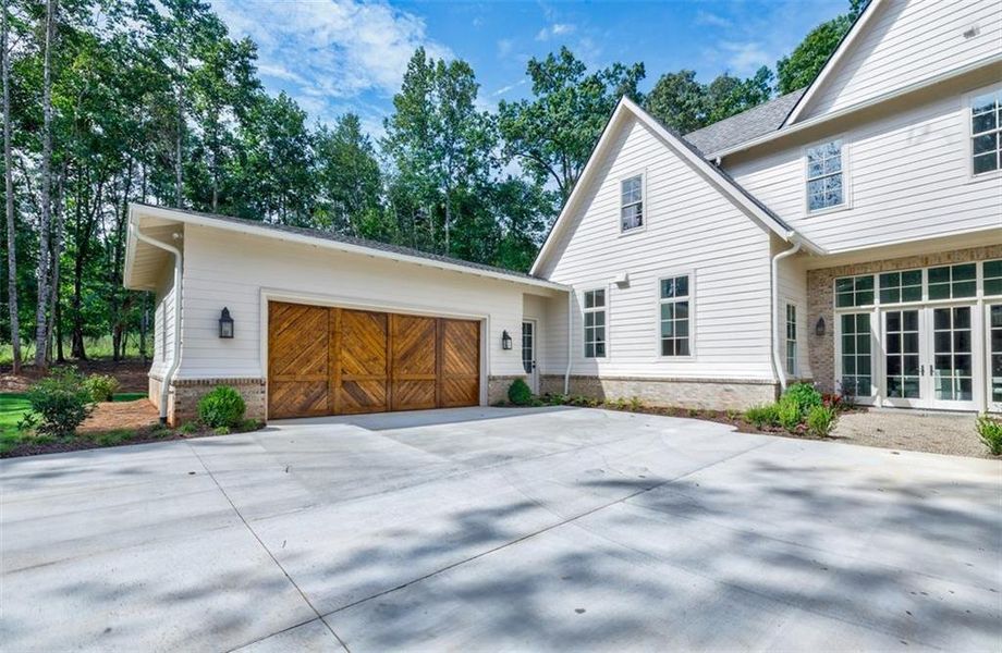 Front exterior of a new home in , Canton, GA, highlighting curb appeal (Image 24).