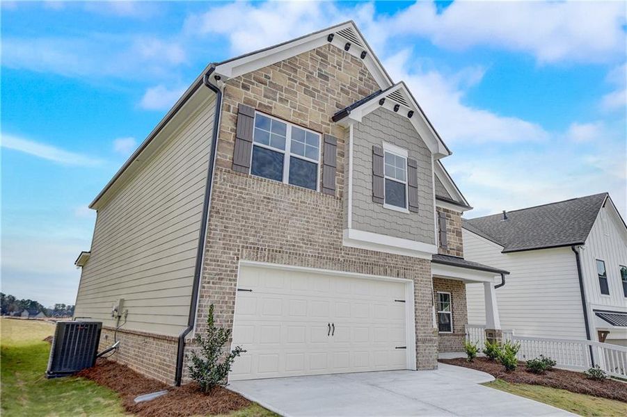 Front exterior of a new home in Summerlin, Winder, GA, highlighting curb appeal (Image 1). Front exterior of a new home in Summerlin, Winder, GA, highlighting curb appeal (Image 1).