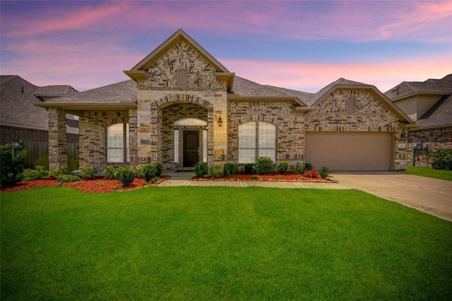 Front exterior of a new home in Elm Estates, Angleton, TX, highlighting curb appeal (Image 27).