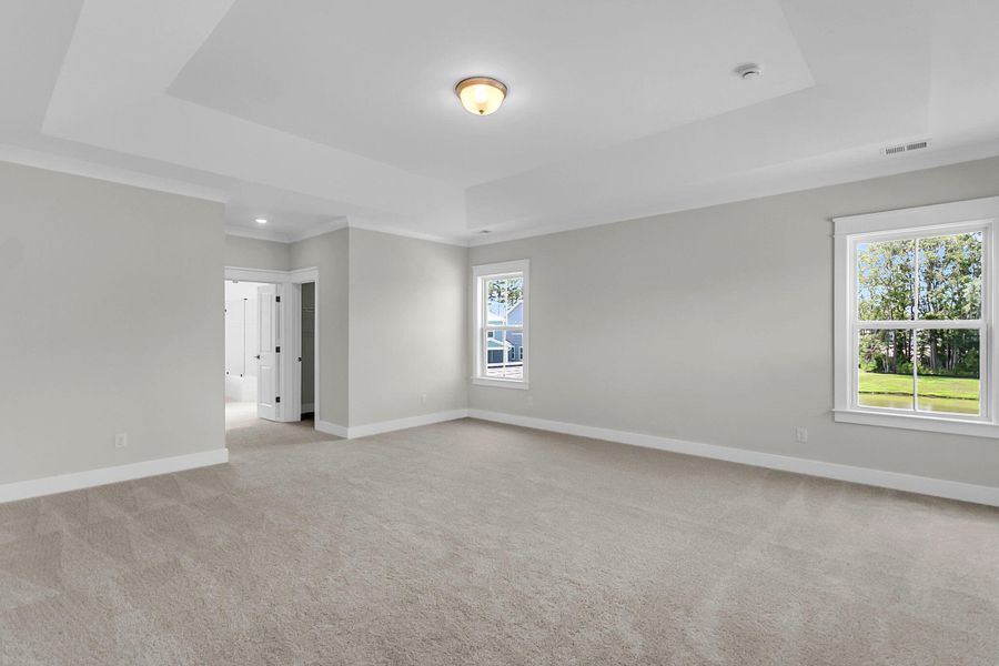Spacious, unfurnished interior of a new home in Tidewater at Lakes of Cane Bay, Summerville (Image 46).