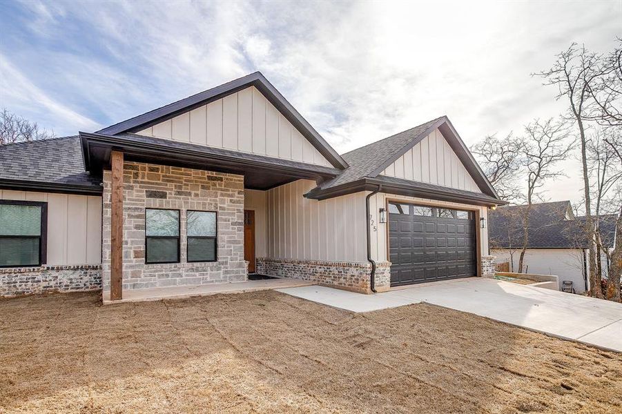 Front exterior of a new home in , Runaway Bay, TX, highlighting curb appeal (Image 27). Front exterior of a new home in , Runaway Bay, TX, highlighting curb appeal (Image 27).