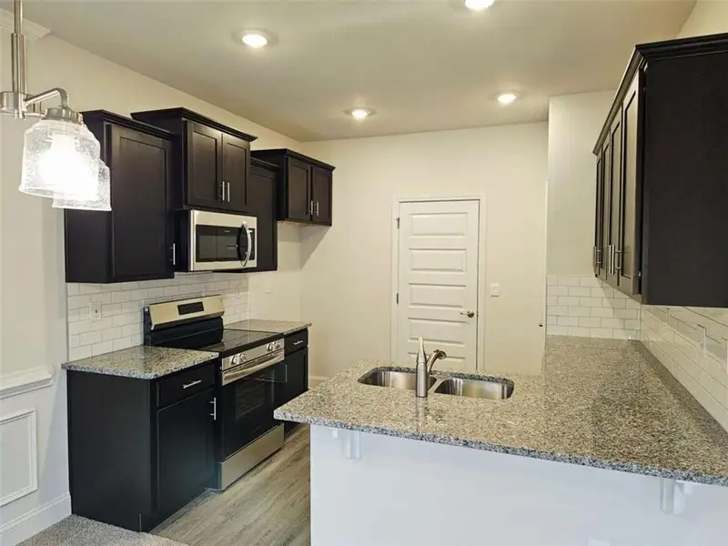 Furnished interior view inside a new home in Scarlett Place, Bowdon (Image 5).
