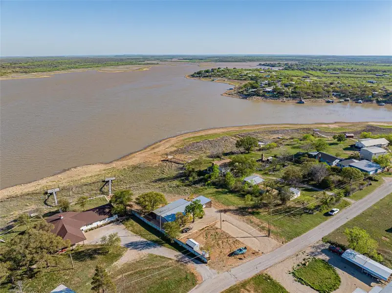 Aerial perspective of suburban area featuring a large body of water Aerial perspective of suburban area featuring a large body of water