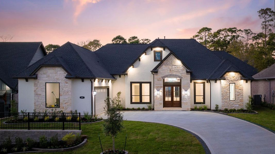 Front exterior of a new home in , Montgomery, TX, highlighting curb appeal (Image 1).