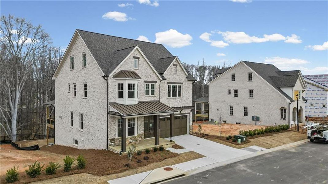 Front exterior of a new home in Laurel View, Suwanee, GA, highlighting curb appeal (Image 30). Front exterior of a new home in Laurel View, Suwanee, GA, highlighting curb appeal (Image 30).