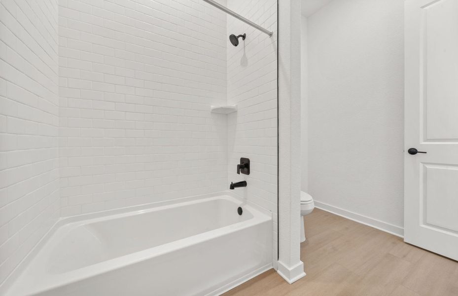 Furnished interior view inside a new home in 6 Creeks, Kyle (Image 6).