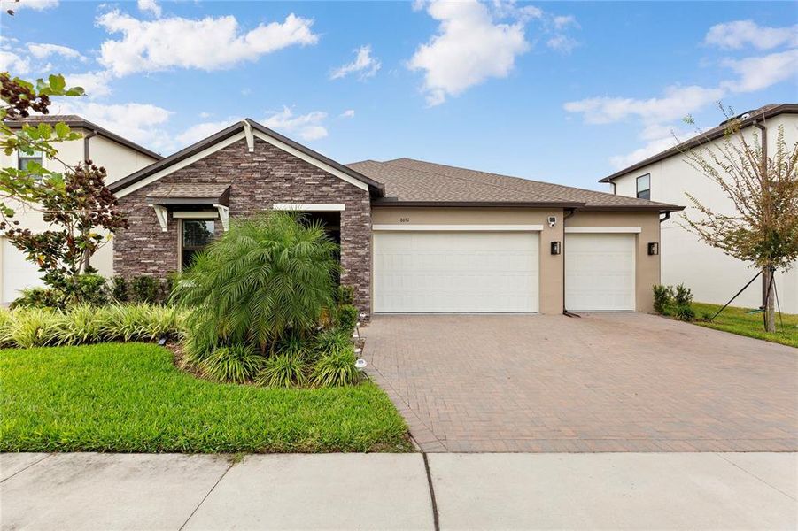 Front exterior of a new home in , Land O' Lakes, FL, highlighting curb appeal (Image 2).