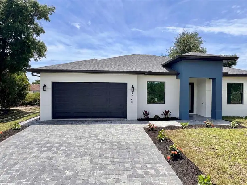 Front exterior of a new home in , Englewood, FL, highlighting curb appeal (Image 2). Front exterior of a new home in , Englewood, FL, highlighting curb appeal (Image 2).
