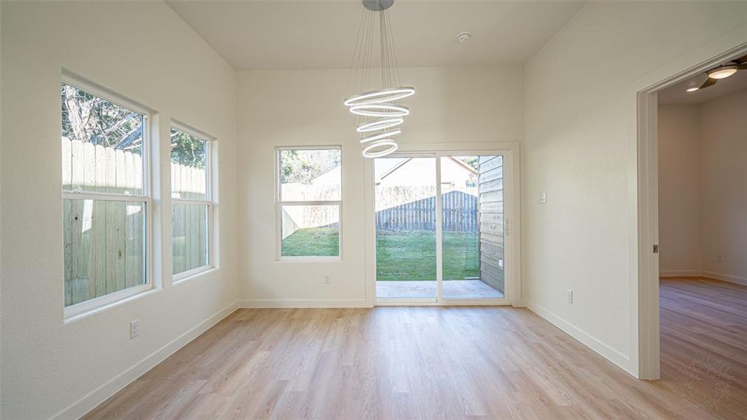 Large dining area! Covered porch and sodded and fenced yard.