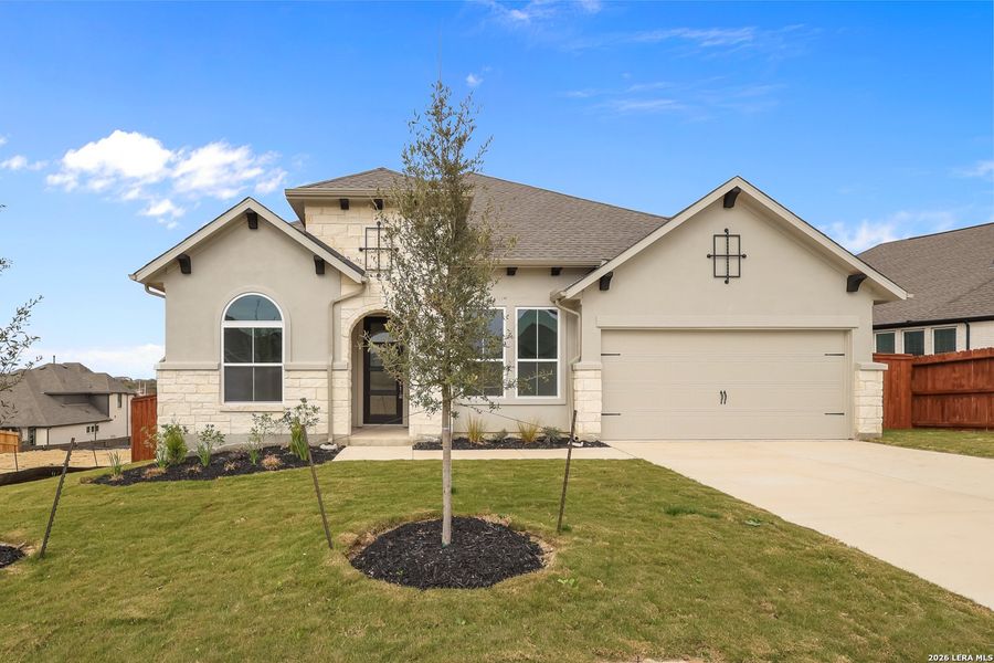 Front exterior of a new home in Homestead, Schertz, TX, highlighting curb appeal (Image 22).