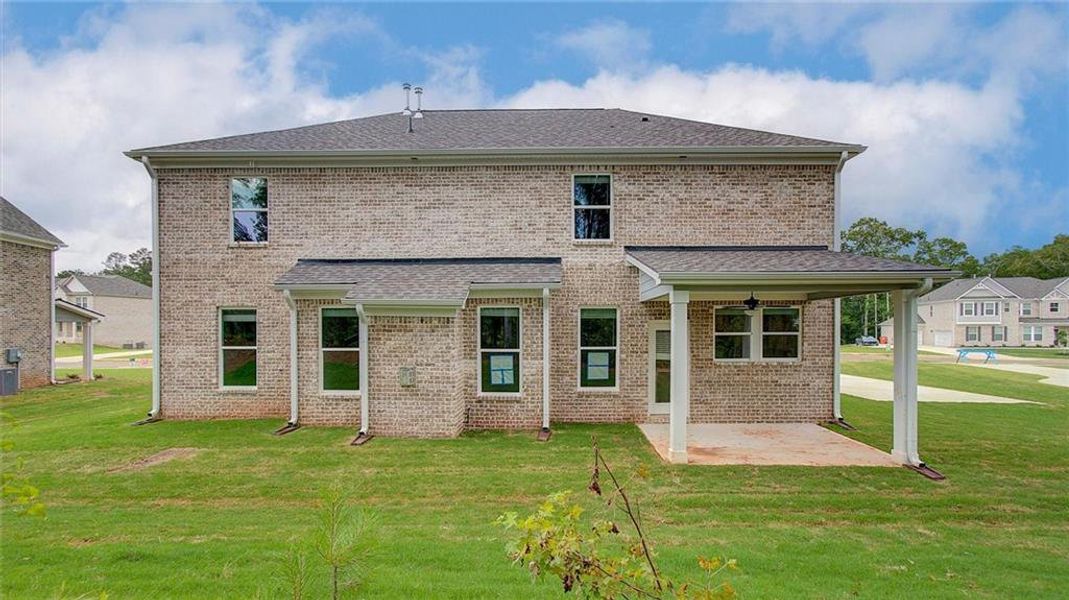 Front exterior of a new home in Trinity Park, McDonough, GA, highlighting curb appeal (Image 2).
