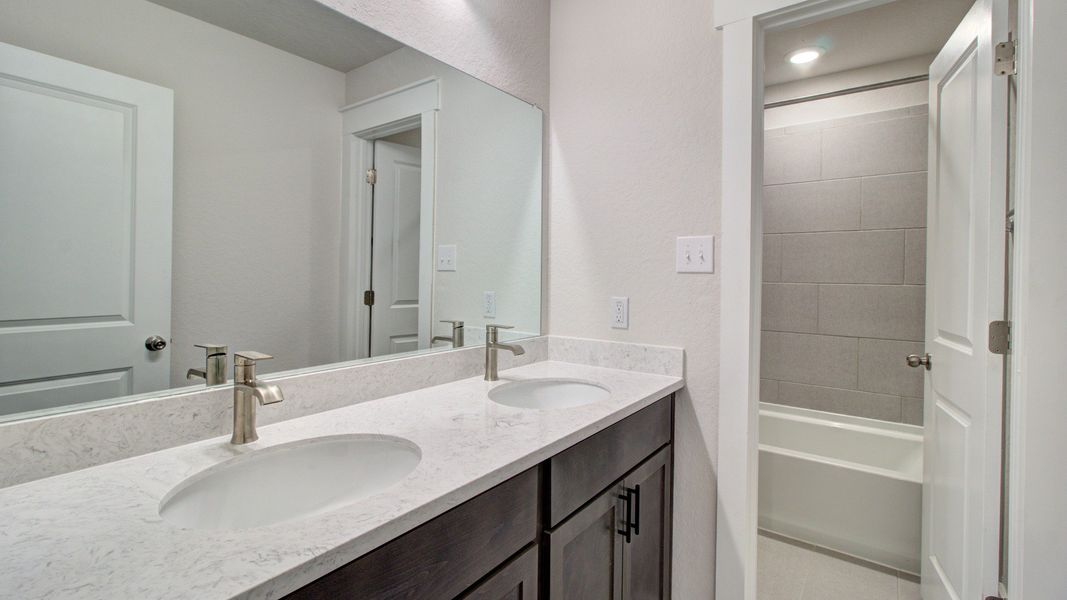 Representative furnished interior of a home built from the Majestic by Brightland Homes in Sunterra, Katy (Image 13).