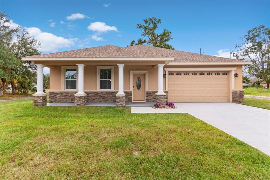 Front exterior of a new home in , Plant City, FL, highlighting curb appeal (Image 1). Front exterior of a new home in , Plant City, FL, highlighting curb appeal (Image 1).
