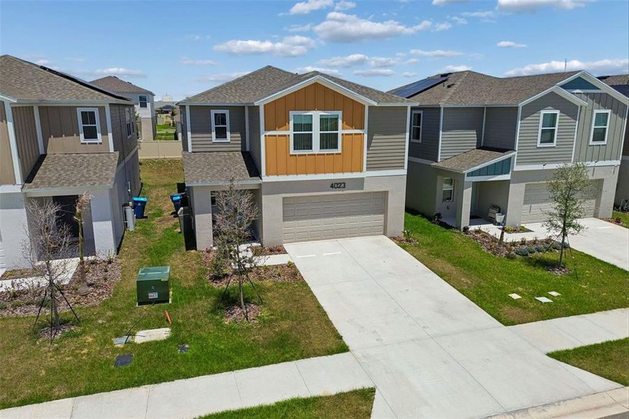 Front exterior of a new home in , Haines City, FL, highlighting curb appeal (Image 24).