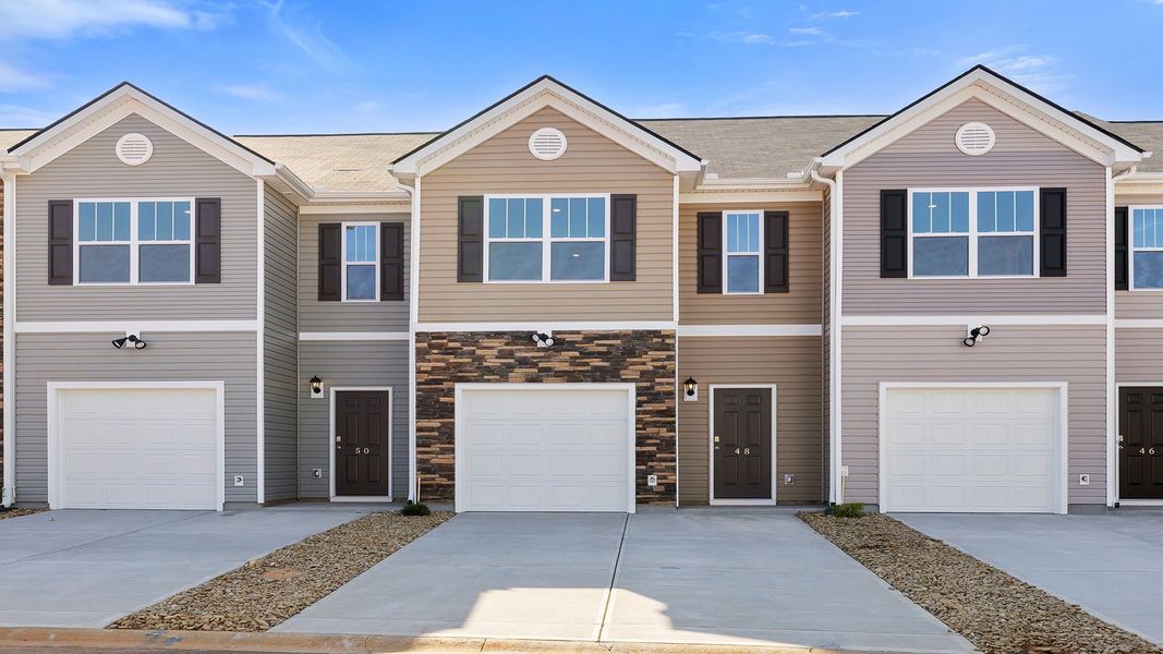 Front exterior of a new home in Brookside Ridge Townhomes, Greer, SC, highlighting curb appeal (Image 1).