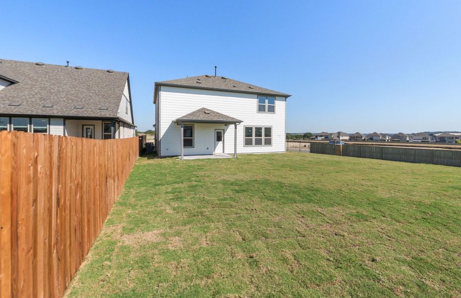 Exterior details and patio area of a home in Saddleback at Santa Rita Ranch, Liberty Hill (Image 17). Exterior details and patio area of a home in Saddleback at Santa Rita Ranch, Liberty Hill (Image 17).