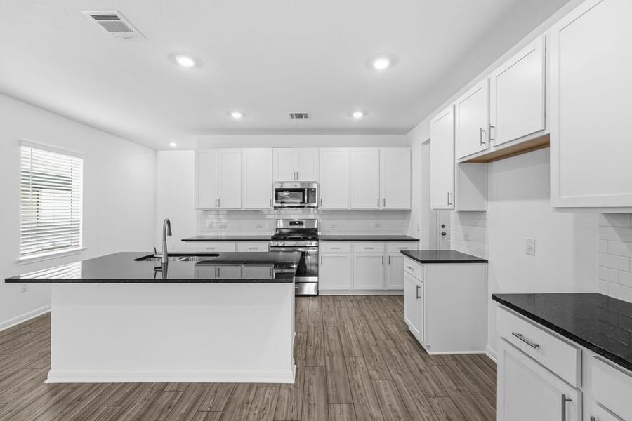 Furnished interior view inside a new home in Longview 40s, Del Valle (Image 4).