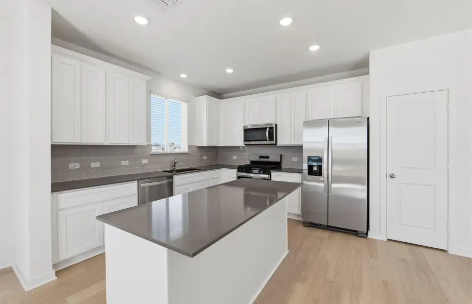 Furnished interior view inside a new home in Cameron Place, Manor (Image 7).