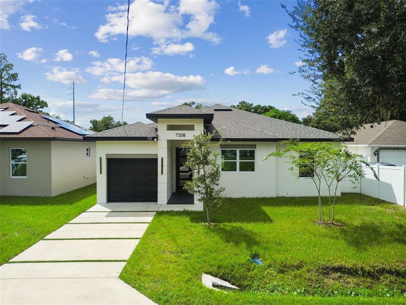 Front exterior of a new home in , Tampa, FL, highlighting curb appeal (Image 41).