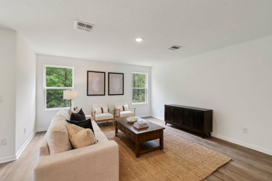 A living room with a fireplace. A living room with a fireplace.